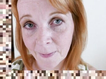 Mature redhead plays with her cunt for you