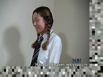 Pigtailed college girl gives a handjob